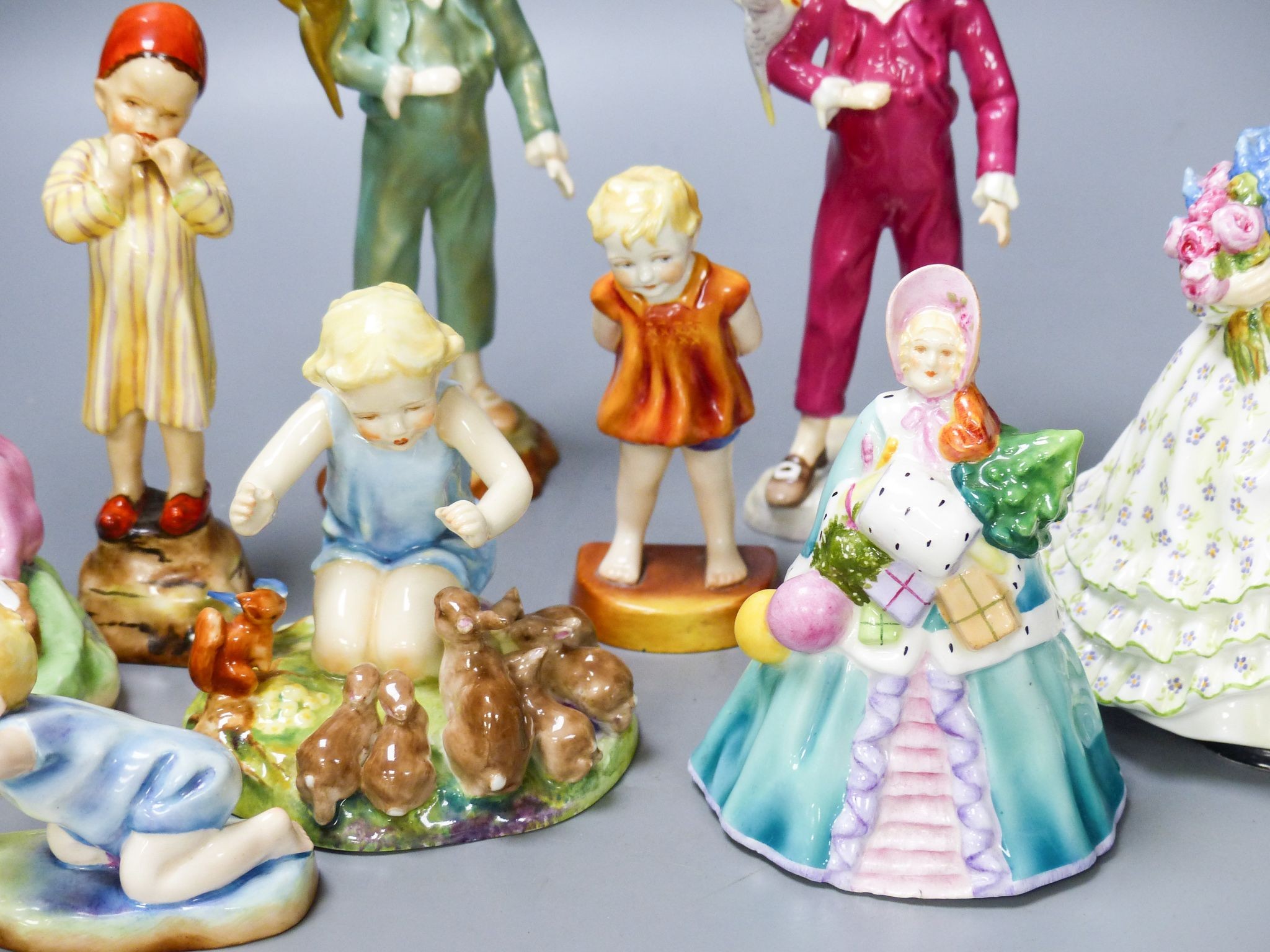 Three Worcester F.G. Doughty figures of children, 4 others and 2 figurines (9)